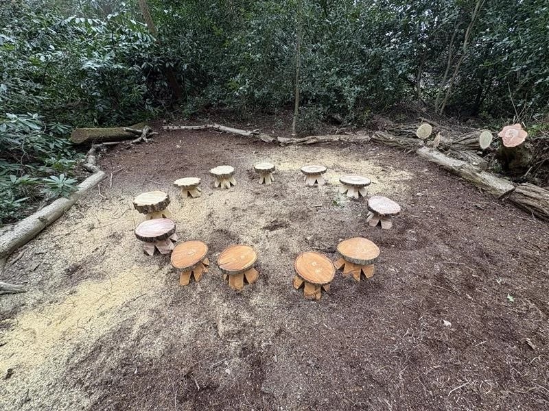 seating area with chainsaw carved stools