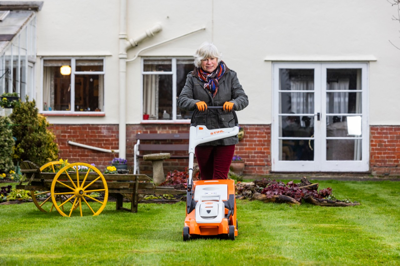 jane moore mowing lawn with STIHL RMA 239 C lawn mower