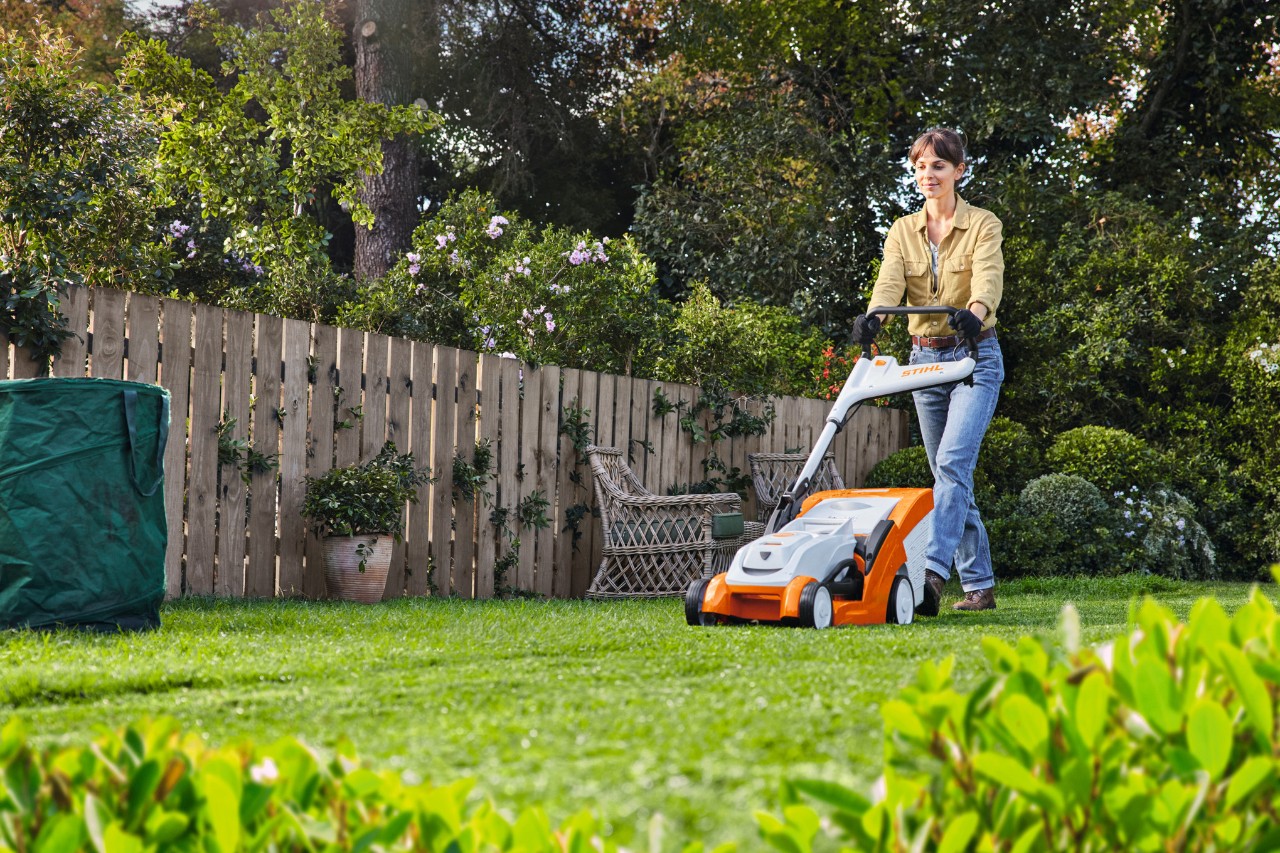Woman mowing with RMA 239