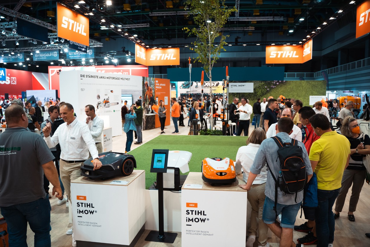 A popular STIHL indoor trade fair stand with iMOW® robotic mowers