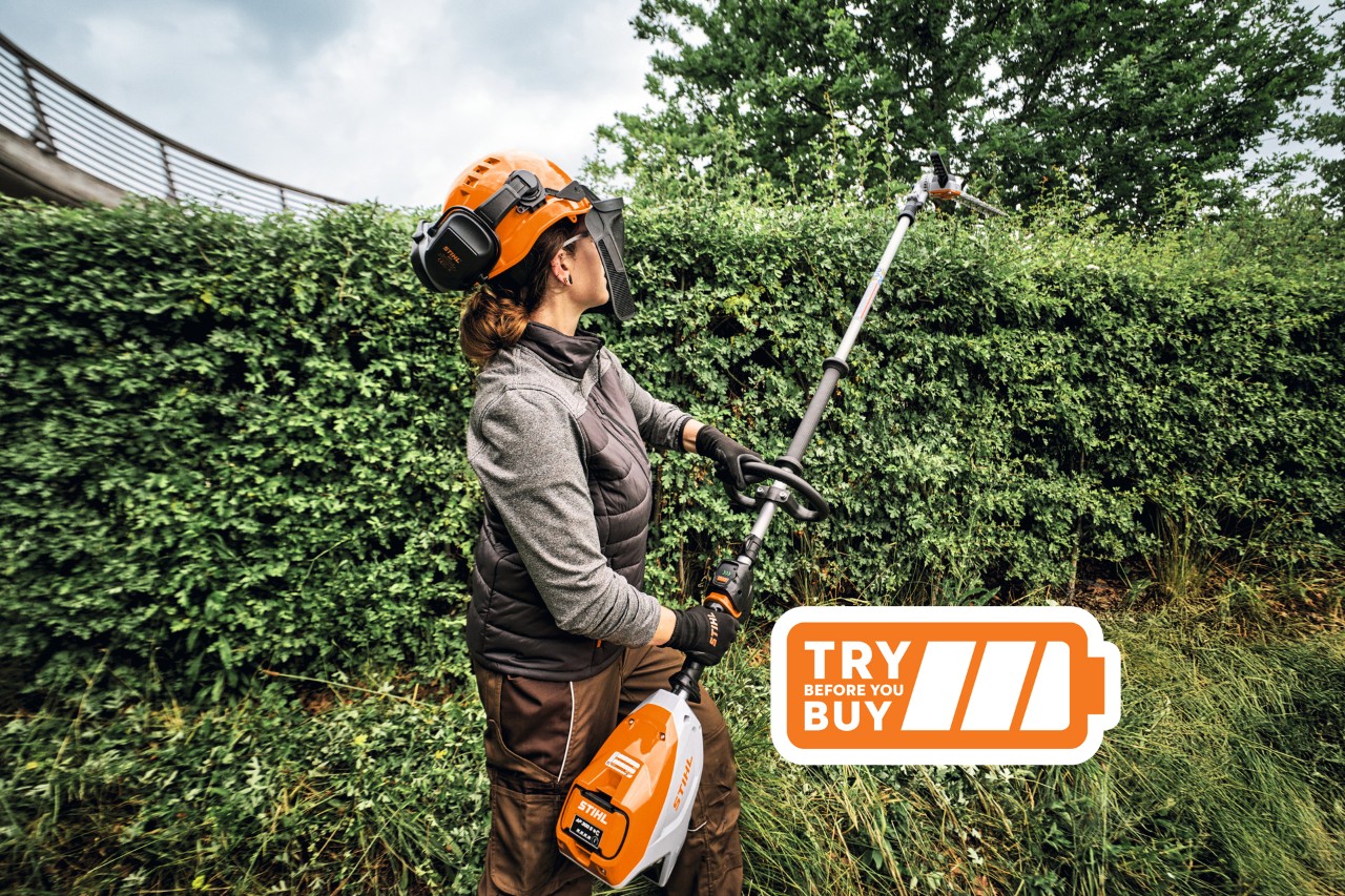 Woman using a battery hedge trimmer with Try Before You Buy logo